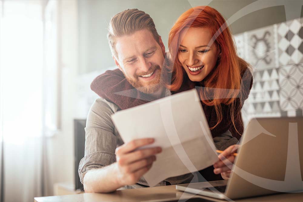 couple smiling over finances